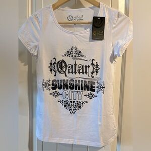 Women’s Authentic “Al Jaber,” Qatar 
White Scoop-Neck Tshirt/Leggings
NWT
Sz M